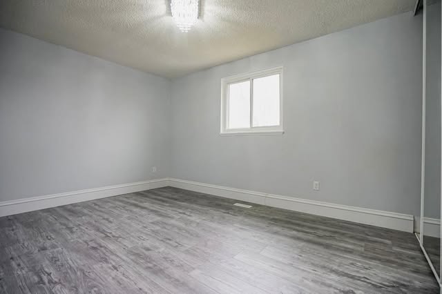 Finished basement renovation with vinyl plank flooring in Brampton