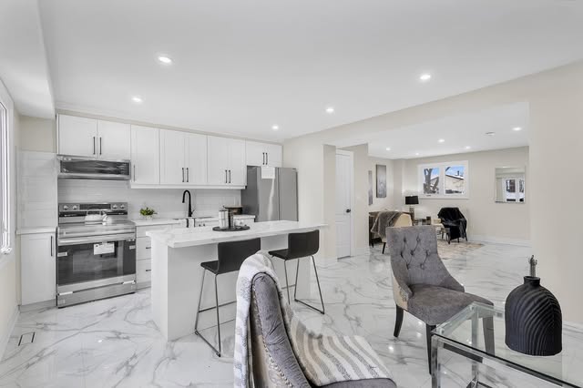 Custom kitchen renovation with built-in wall ovens and island in Mississauga