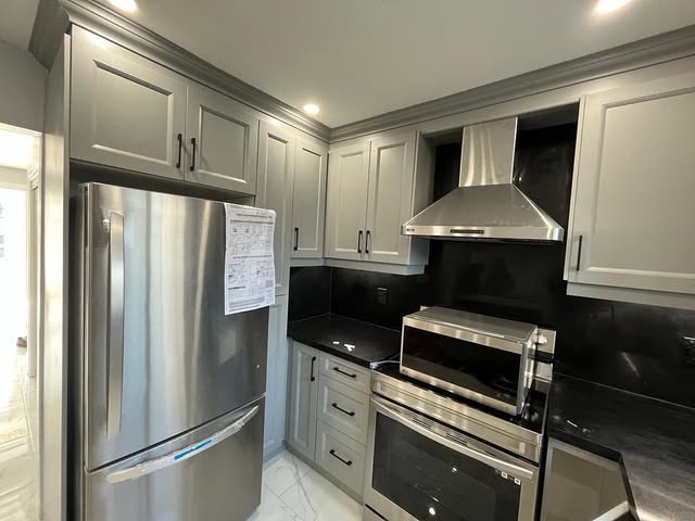 Kitchen remodel with granite countertops and custom grey cabinets in Brampton