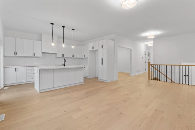 Open-concept main floor with new hardwood flooring in Brampton